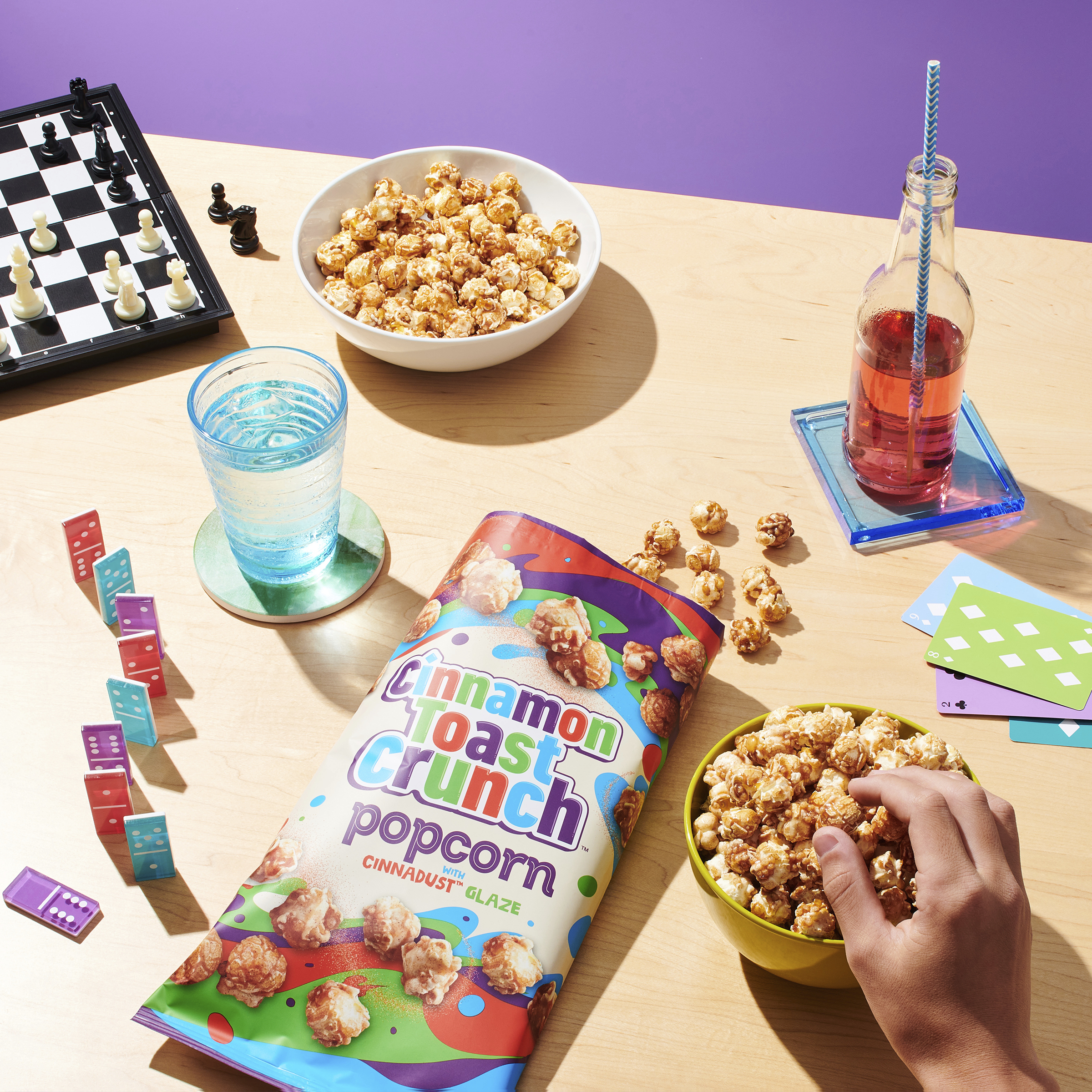 Cinnamon Toast Crunch popcorn on a table with games